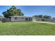 Well-maintained single-story home with green lawn and landscaping, showcasing curb appeal at 4611 Spahn St, Sarasota, FL 34232