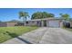 Charming single-story home featuring a well-manicured lawn, and a welcoming front entrance at 4611 Spahn St, Sarasota, FL 34232