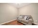 A cozy sitting room features hardwood floors and a comfortable sofa and throw pillows at 4611 Spahn St, Sarasota, FL 34232