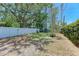 Spacious backyard with a tall white fence, providing privacy and security for outdoor activities at 4907 18Th W Ave, Bradenton, FL 34209