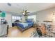 Comfortable bedroom with natural light, ceiling fan, and a dedicated desk area at 4907 18Th W Ave, Bradenton, FL 34209