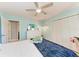 Bright bedroom with hardwood floors, ceiling fan, double closet, and accent wall, a perfect blend of comfort and style at 4907 18Th W Ave, Bradenton, FL 34209