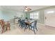 Dining room with seating for six near the front door and a ceiling fan at 4907 18Th W Ave, Bradenton, FL 34209