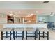 Kitchen island bar with seating featuring granite counters and stainless steel appliances at 4907 18Th W Ave, Bradenton, FL 34209