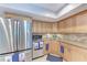 Kitchen features stainless steel appliances and wood cabinetry with granite countertops at 4907 18Th W Ave, Bradenton, FL 34209