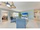 Cozy living room with tile flooring and a ceiling fan, offering a comfortable and inviting space at 4907 18Th W Ave, Bradenton, FL 34209