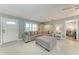 Bright living room with tile flooring, an inviting sofa and adjacent music room at 4907 18Th W Ave, Bradenton, FL 34209