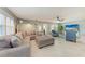 Spacious living room featuring tile floors, comfortable seating, and large windows offering natural light at 4907 18Th W Ave, Bradenton, FL 34209