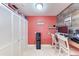 A home office has rustic wood panels and a large closet for maximum storage at 4907 18Th W Ave, Bradenton, FL 34209