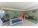 Relaxing screened-in patio area with cozy seating, dining table, and ceiling fan is ideal for outdoor enjoyment at 4907 18Th W Ave, Bradenton, FL 34209