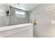 Walk-in shower with a rainfall showerhead, handheld wand, and a built-in bench at 4907 18Th W Ave, Bradenton, FL 34209