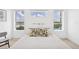 Bright bedroom with large windows, natural light, and modern decor at 516 Tamiami S Trl # 306, Nokomis, FL 34275