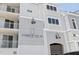 Attractive condo building featuring Harbor Villas with balconies and neutral toned exterior paint at 516 Tamiami S Trl # 306, Nokomis, FL 34275
