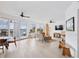 Bright and airy living room with views of the water, light wood flooring and coastal decor at 516 Tamiami S Trl # 306, Nokomis, FL 34275