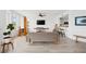 Open-concept living space with a large window view and hardwood floors at 516 Tamiami S Trl # 306, Nokomis, FL 34275