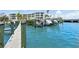 Waterfront home features a private boat dock with boats on lifts and dockage for several vessels at 516 Tamiami S Trl # 306, Nokomis, FL 34275