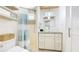 Bathroom featuring a glass bowl sink, decorative backsplash and tiled walk-in shower at 5238 Susan Ave, Sarasota, FL 34231