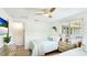 Inviting bedroom with twin beds, TV, and natural light creating a relaxing space perfect for unwinding and rejuvenation at 5238 Susan Ave, Sarasota, FL 34231