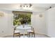 Breakfast nook with a round table and chairs offering a view of the well-maintained backyard at 5238 Susan Ave, Sarasota, FL 34231