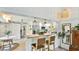 Eat-in kitchen with butcher block counter, stainless steel appliances, and bar seating open to living spaces at 5238 Susan Ave, Sarasota, FL 34231