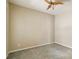Bedroom with a ceiling fan and neutral walls and carpet floors at 5418 Fairfield Blvd, Bradenton, FL 34203