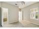 Bedroom with a ceiling fan and a window and a view of a closet at 5418 Fairfield Blvd, Bradenton, FL 34203