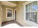 Covered entryway with brick flooring and neutral colored walls at 5418 Fairfield Blvd, Bradenton, FL 34203