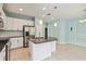 Open kitchen with an island, granite countertops, and stainless steel appliances at 5418 Fairfield Blvd, Bradenton, FL 34203