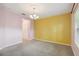 Open room featuring carpet floors and a yellow accent wall at 5418 Fairfield Blvd, Bradenton, FL 34203