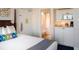 Cozy bedroom with partial kitchen including microwave and coffee maker, and an en suite bathroom at 5500 Gulf Blvd # 6248, St Petersburg, FL 33706