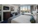 Comfortable bedroom featuring two queen beds, a dresser, sitting area, and a balcony view at 5500 Gulf Blvd # 6248, St Petersburg, FL 33706