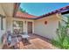 Cozy courtyard features a brick patio and comfortable seating, ideal for enjoying outdoor relaxation at 5651 Golf Pointe Dr # 5651, Sarasota, FL 34243