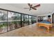 Beautiful water view from the sliding glass doors in this game room, featuring a pool table at 5651 Golf Pointe Dr # 5651, Sarasota, FL 34243