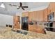 Updated kitchen with granite countertops, stainless steel appliances, and tile backsplash at 5651 Golf Pointe Dr # 5651, Sarasota, FL 34243