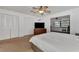 Bright main bedroom with carpet flooring, ceiling fan, dresser, and ensuite access at 5651 Golf Pointe Dr # 5651, Sarasota, FL 34243
