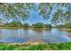 Lovely water view of the pond, showcasing the community and its landscaped perimeters at 5651 Golf Pointe Dr # 5651, Sarasota, FL 34243
