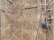 Shower with decorative tile surround, shower head, and built-in niche at 5651 Golf Pointe Dr # 5651, Sarasota, FL 34243