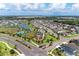Community aerial view highlighting the lake, pool, green spaces, and central community gathering areas at 5735 Bungalow Grove Ct, Palmetto, FL 34221