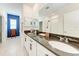 Primary bathroom featuring a double sink vanity with granite countertops at 5735 Bungalow Grove Ct, Palmetto, FL 34221