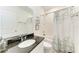 Bright bathroom featuring a vanity with a granite countertop and a shower with tub combination at 5735 Bungalow Grove Ct, Palmetto, FL 34221