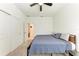 Bedroom with a closet, ceiling fan, carpet flooring, a comfortable bed, and an ensuite bathroom at 5735 Bungalow Grove Ct, Palmetto, FL 34221