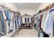 Spacious walk-in closet with ample storage space and shelving at 5735 Bungalow Grove Ct, Palmetto, FL 34221