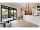Modern lounge area features stylish seating with access to an outdoor space, perfect for relaxing at 5735 Bungalow Grove Ct, Palmetto, FL 34221