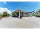 Open-air community pavilion featuring picnic tables and a concrete patio, perfect for outdoor gatherings at 5735 Bungalow Grove Ct, Palmetto, FL 34221