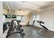 Weight training and fitness equipment in a well-lit workout room with ample space for achieving fitness goals at 5735 Bungalow Grove Ct, Palmetto, FL 34221