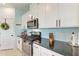 Close-up of the kitchen appliances, including the stainless steel oven and microwave at 5735 Bungalow Grove Ct, Palmetto, FL 34221