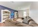 Comfortable living room with dark wood floors and a large sectional sofa at 5735 Bungalow Grove Ct, Palmetto, FL 34221
