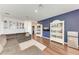 Inviting living room featuring hardwood floors and built-in bookshelves at 5735 Bungalow Grove Ct, Palmetto, FL 34221