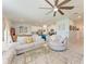 Spacious open-concept living area with kitchen access and comfortable seating, ideal for entertaining guests at 5735 Bungalow Grove Ct, Palmetto, FL 34221
