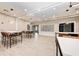 This lounge features stylish tables and chairs, bright lighting, and modern decor at 5735 Bungalow Grove Ct, Palmetto, FL 34221